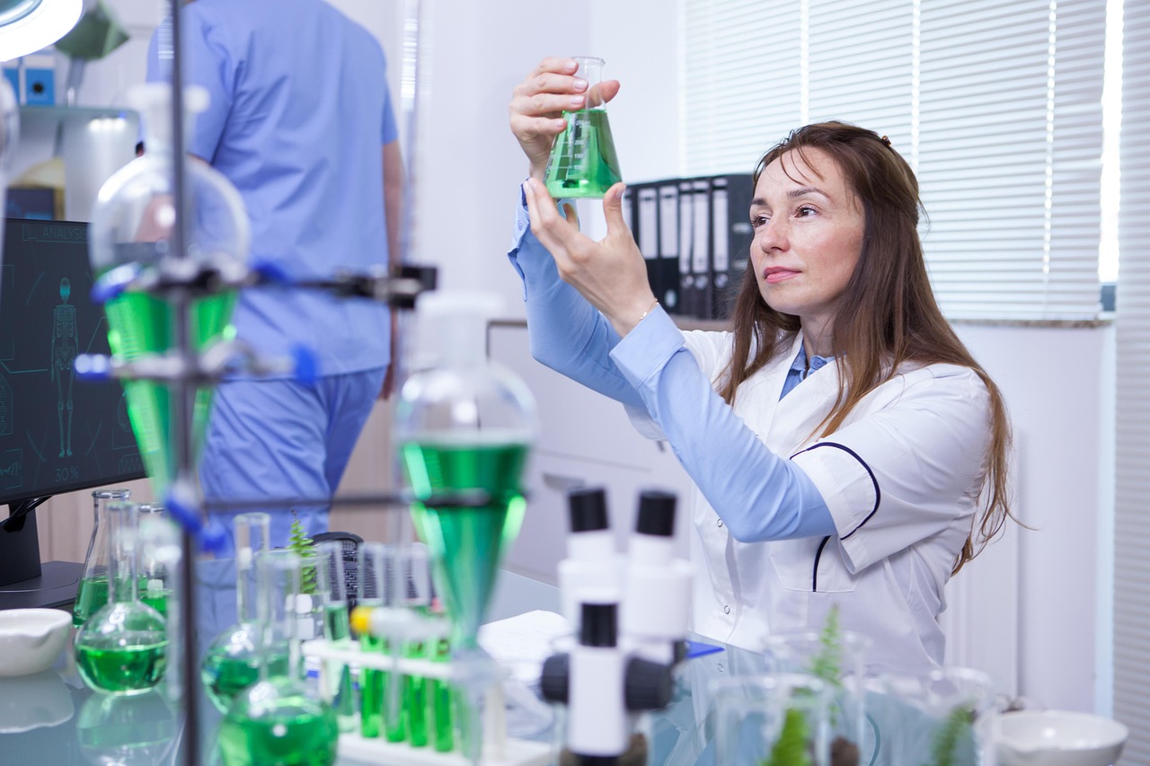 Scientist with green biotech samples